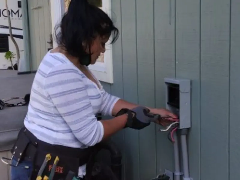 Licensed electrician wiring an exterior subpanel in Heber